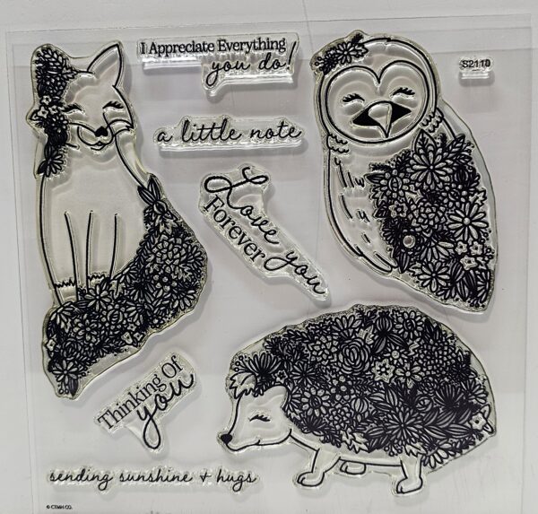 clear acrylic stamp with a fox, owl and hedgehog